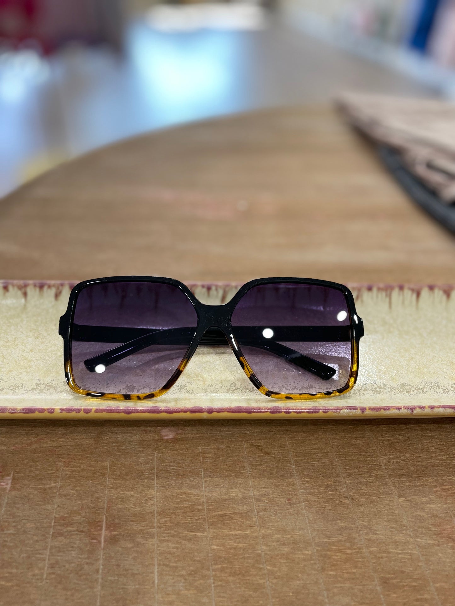 Oversized black and tortoise shell sunglasses